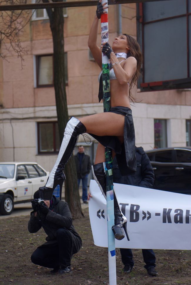 girl on street doing striptease show