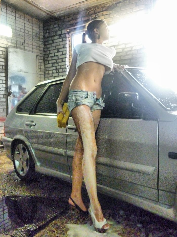 cute young car wash girl in short jeans
