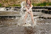Babes: young strawberry blonde girl strips her bikini at the river