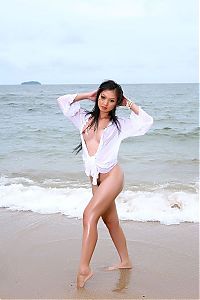 Babes: black haired girl from asia on the beach