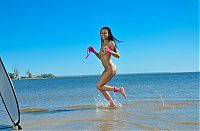 Babes: young black haired girl on the beach in a pink underwear