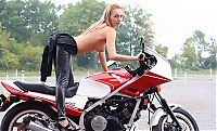 Babes: blonde girl undresses her leather overall on the honda motorcycle