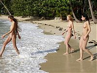Babes: three cute young girls relaxing on caribbean beach at beautiful sunny day