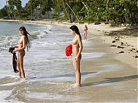 Babes: three cute young girls relaxing on caribbean beach at beautiful sunny day