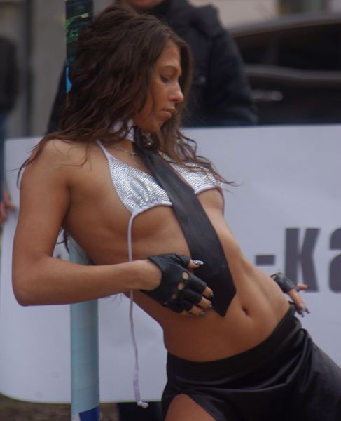 girl on street doing striptease show