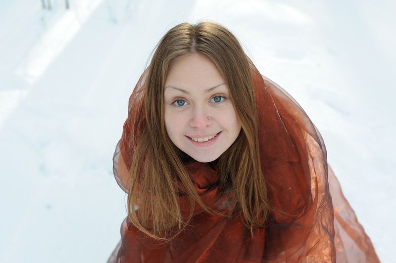 young brunette girl in forest with snow