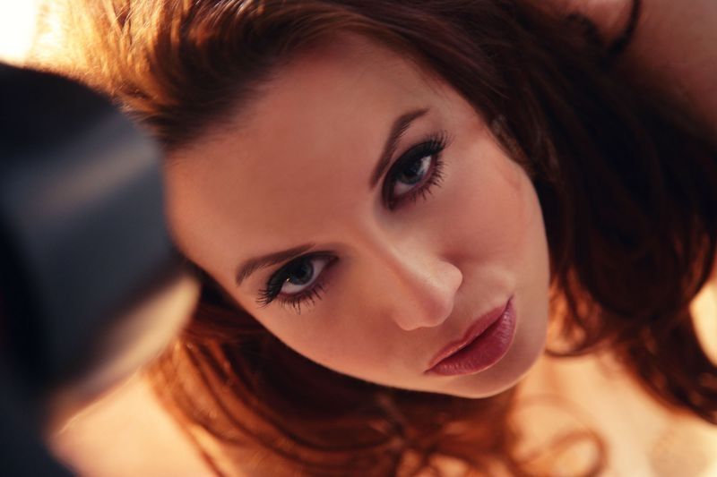 brunette girl with a big light