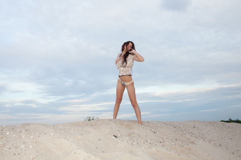 young red haired girl on the sand