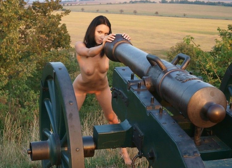 young brunette girl shows off on the cannon