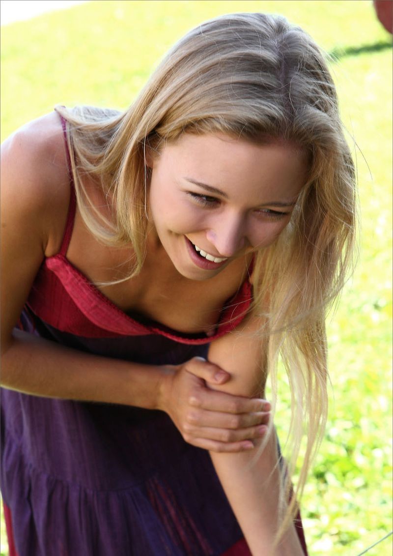 cute young blonde girl travels around the country