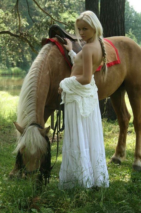 young girl naked with a horse