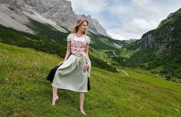 young blonde girl in the swiss alps