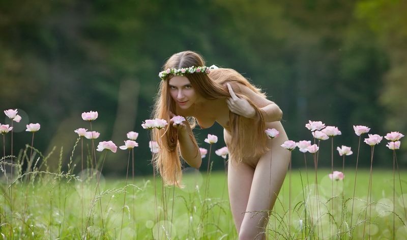 young brunette girl outside in the nature like a nymph