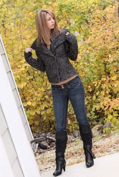 young blonde girl outside in the autumn fall nature