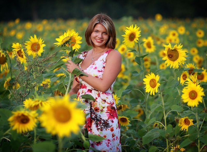 blonde girl on a field of sunflowers