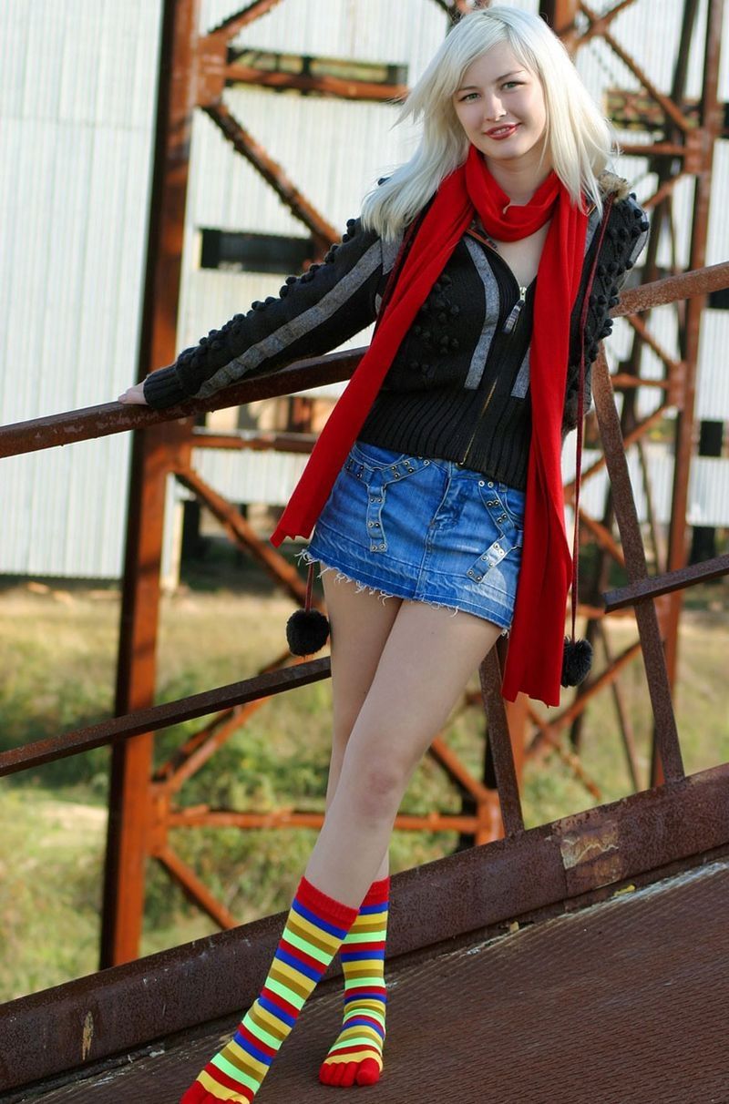 young blonde girl wearing rainbow socks