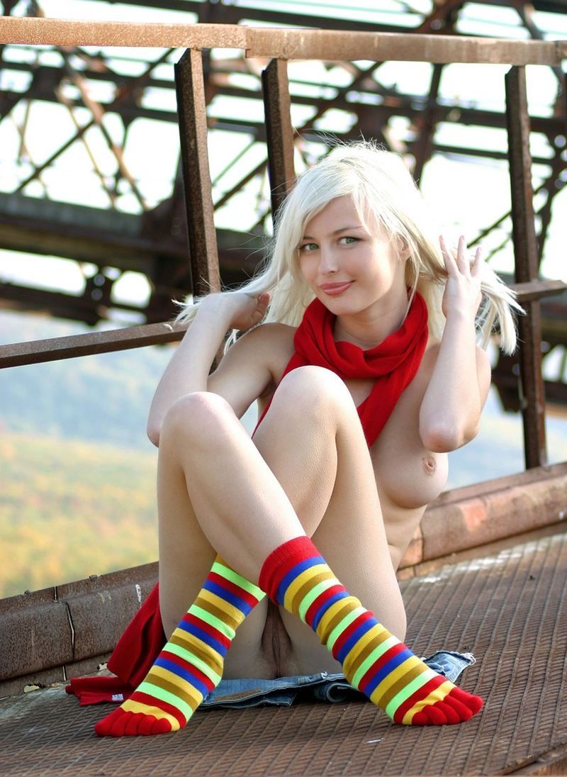 young blonde girl wearing rainbow socks