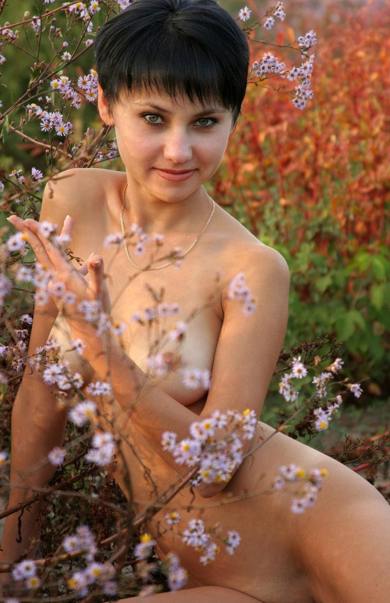 black haired girl in the field of flowers