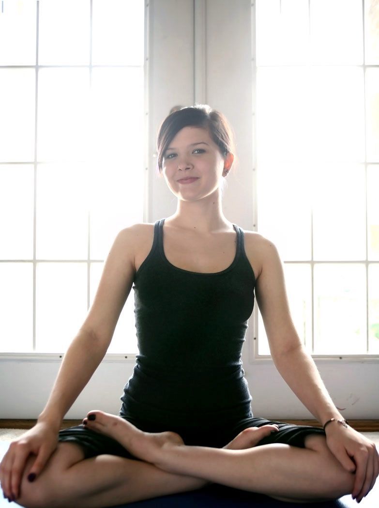 young brunette girl doing gymnastic exercises