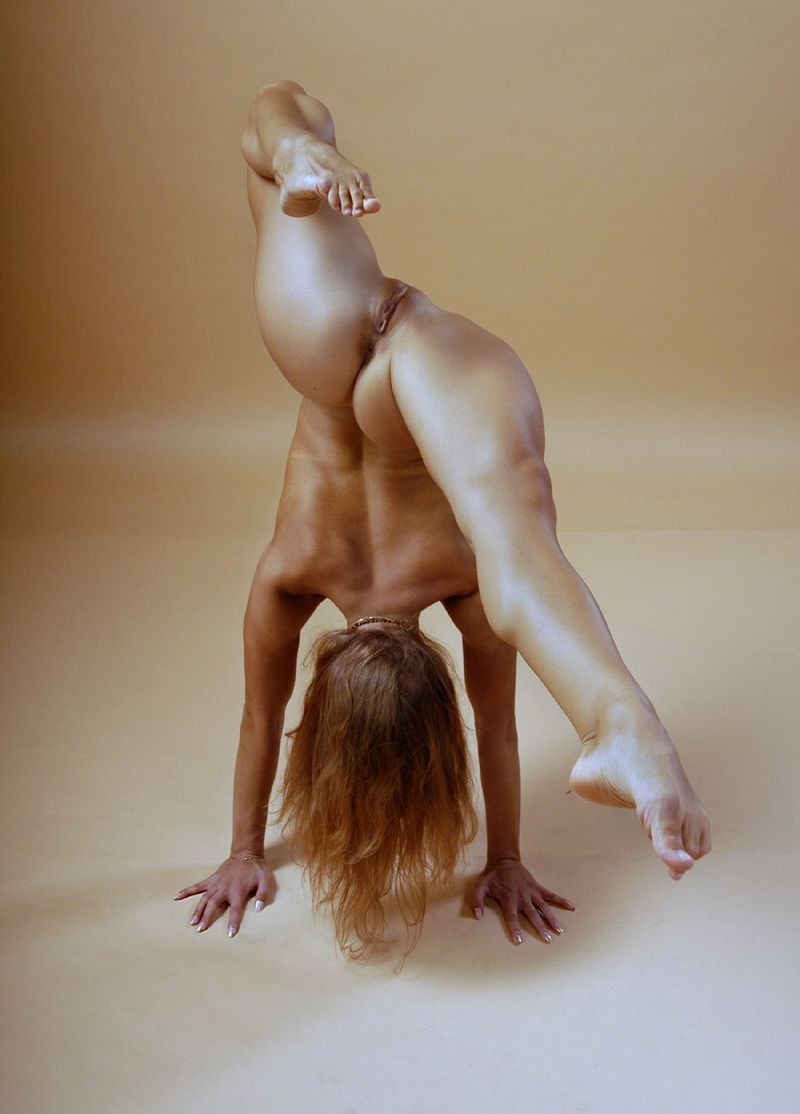 young brunette girl doing flexible gymnastic exercises