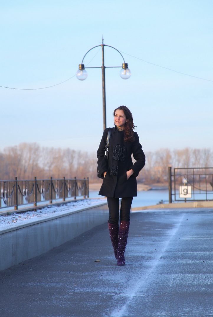 young brunette girl outside near the lake