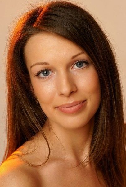 cute young brunette girl with a red dress and chair