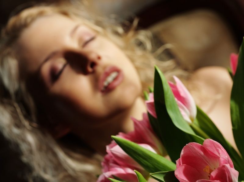 young blonde girl changing her evening dress at home