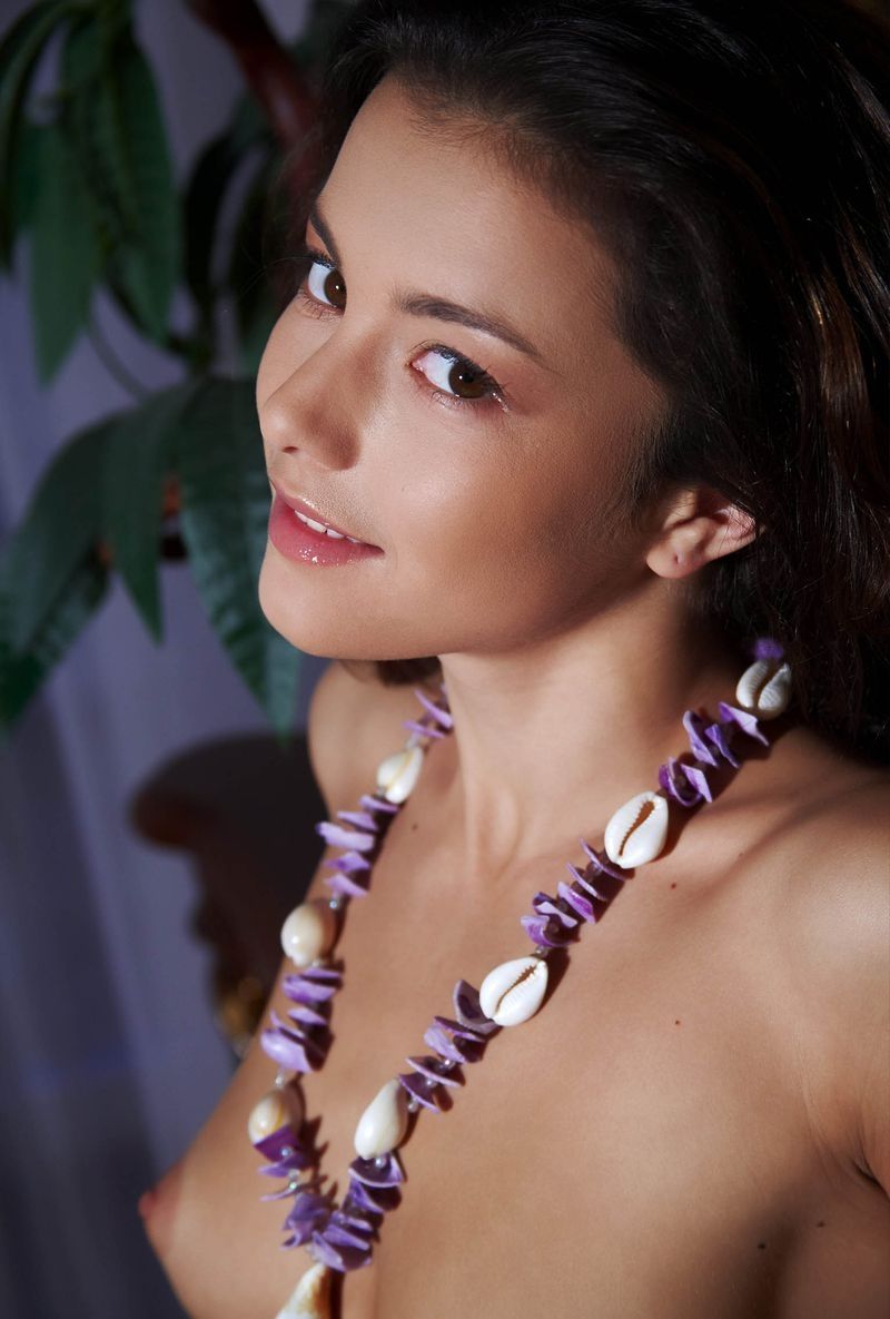 young brunette girl wearing a seashell necklace