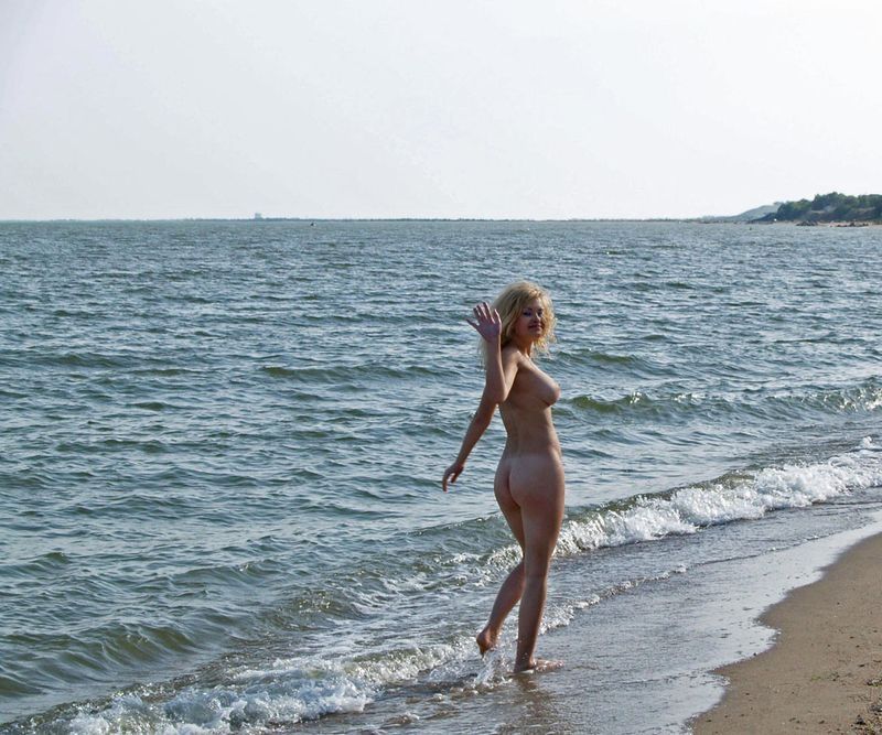 blonde girl posing in the sea