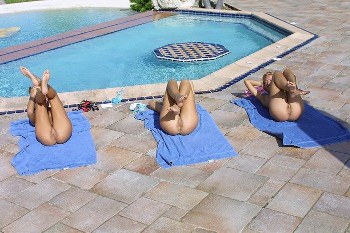 young girls outside at the pool doing physical exercises