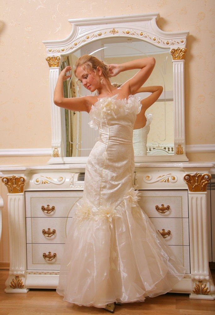 young blonde girl strips from the wedding dress