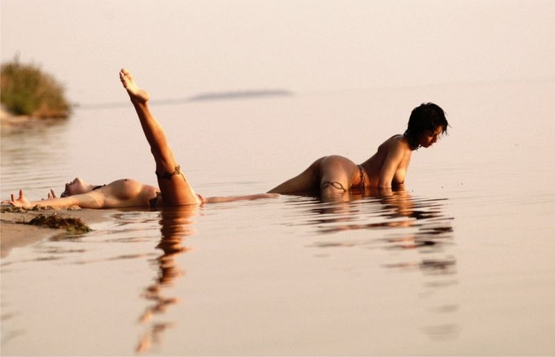 two young girls posing in the lake