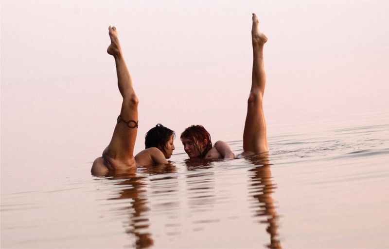 two young girls posing in the lake