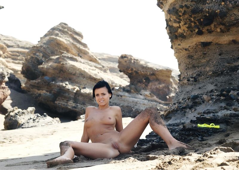 young black haired girl in the sand
