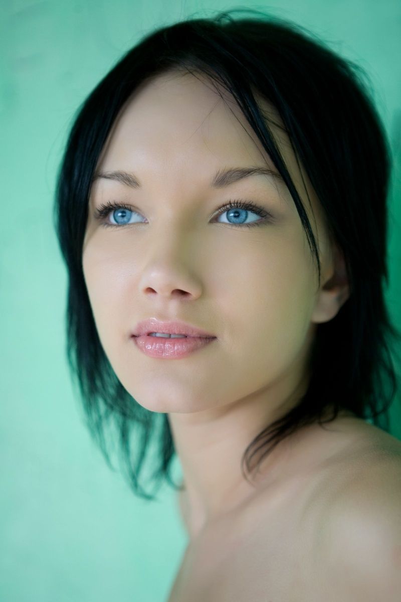 cute young black haired girl with blue eyes