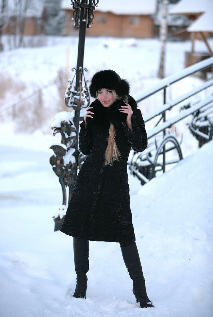 blonde girl wearing black coat in the winter