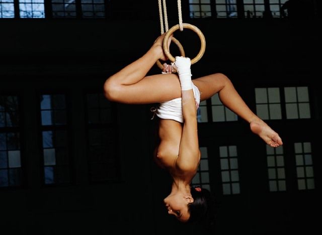 brunette girl doing gymnastic exercises