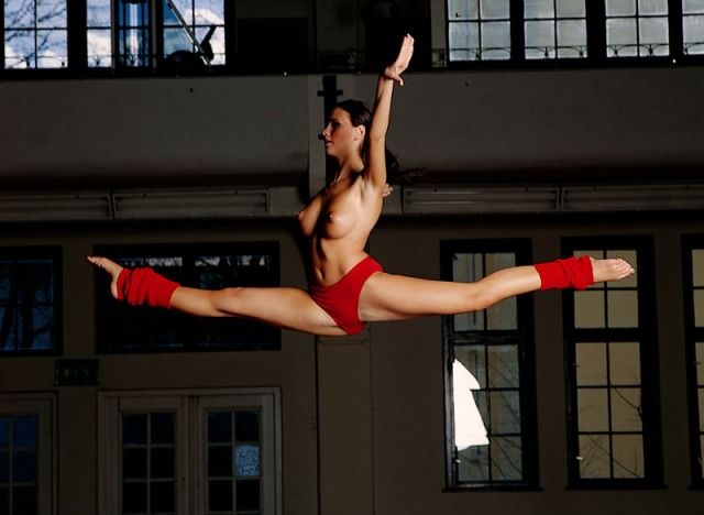 brunette girl doing gymnastic exercises