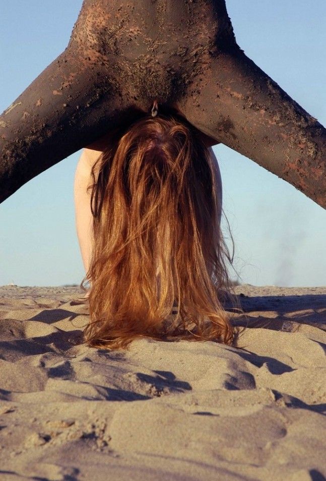 two young dirty girls show off on the sand