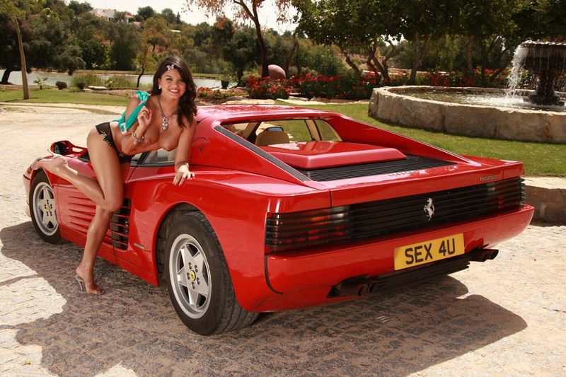 curly brunette girl strips on the ferrari testarosa