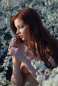 Babes: red haired girl near tree with white flowers