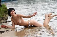 Babes: young black haired girl on the bank of the river