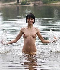 Babes: young black haired girl on the bank of the river