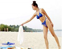 Babes: brunette girl on beach in blue swimsuit