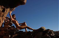 Babes: young brunette girl sunbathing on rocks