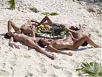 Babes: girls at the beach lying in the sand
