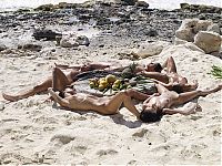 Babes: girls at the beach lying in the sand