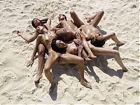Babes: girls at the beach lying in the sand