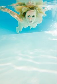 Babes: young reddish blonde girl enjoys the swimming pool