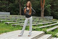 Babes: young brunette girl with long hair wearing silver pants on stairs